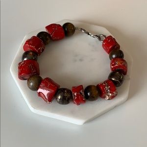 Red beaded bracelet with silver chain